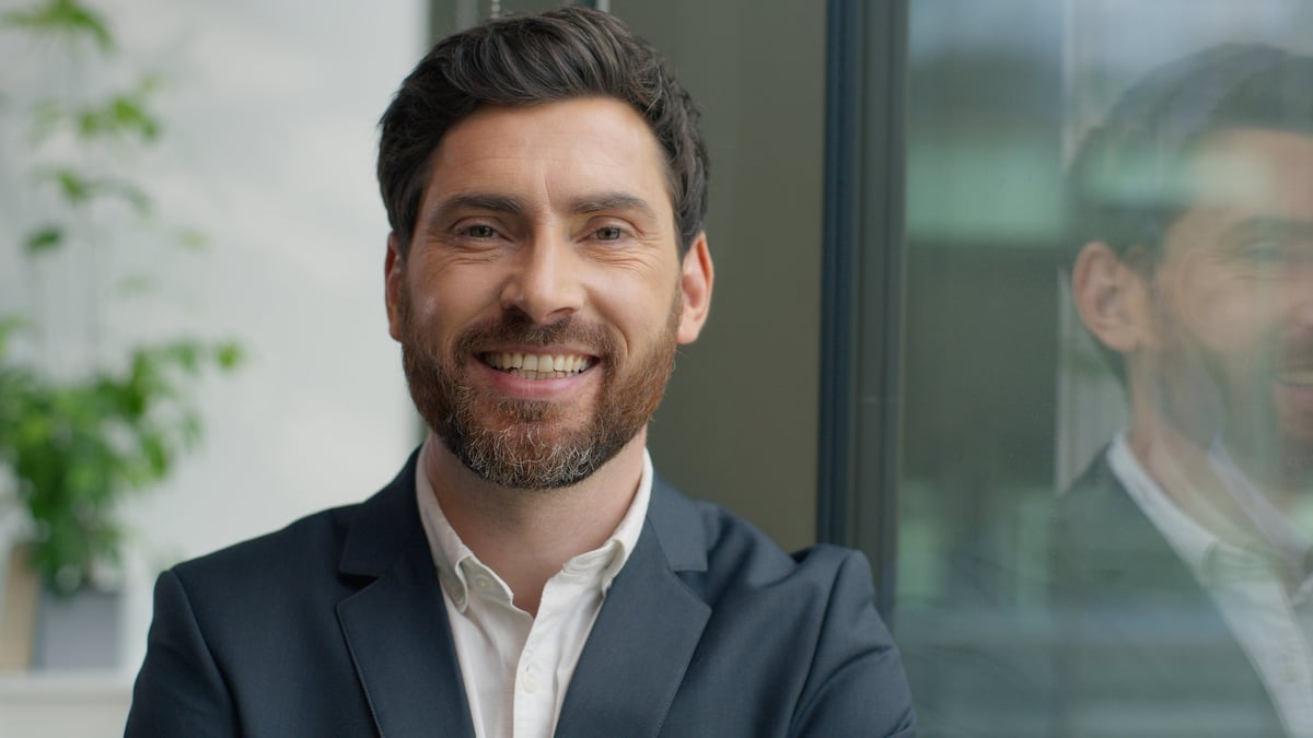 Portrait happy smiling confident Caucasian middle-aged business man looking at camera smile toothy in office adult businessman male manager employer entrepreneur startup innovation owner posing indoor. High quality photo